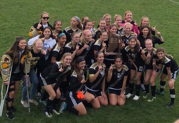 GHS girls soccer team posing with their sectional championship trophy. 