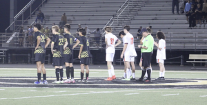 Both teams line up for the penalty shootout after going into double overtime.