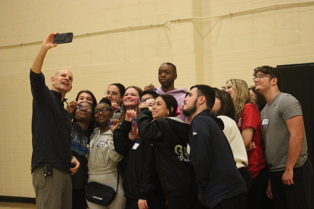 At the end of the event, the NHS students gather around Ted for a group photo.