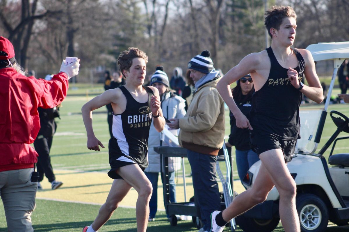 Gabriel Goral and Austin Homans sprint to the finishline while competing at a meet without the home track advantage. 