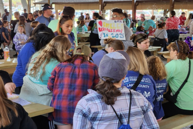 Members take part in bead bracelet-making.