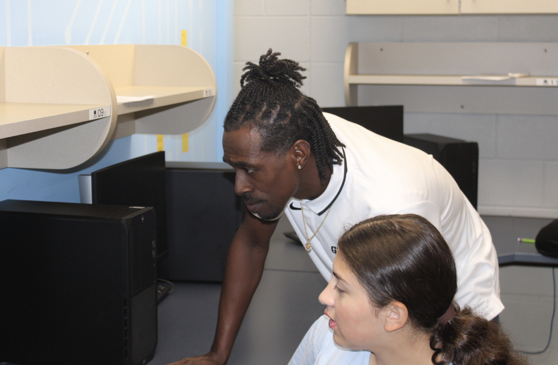 Mr. Ashley helps out a student during his first period class.