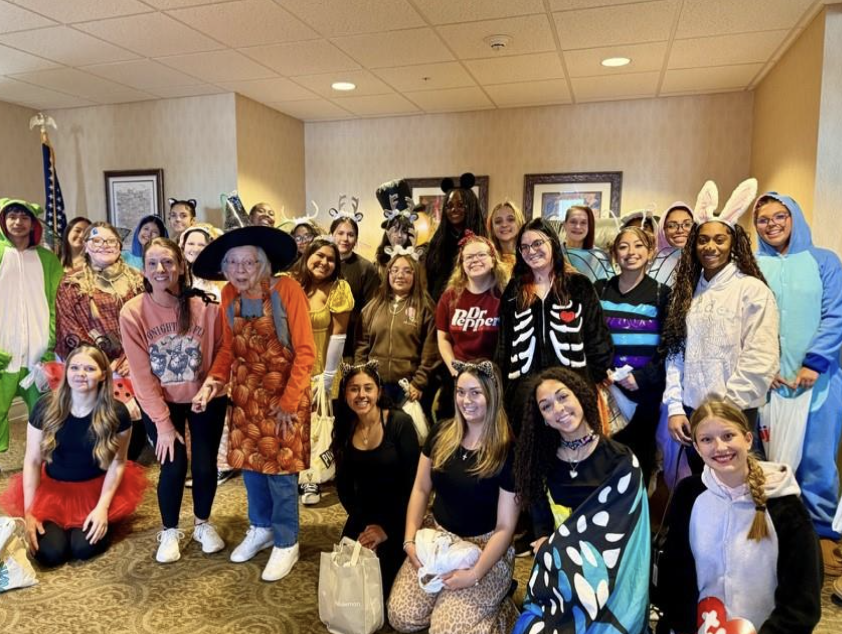 Griffith High School students dress up and see the residents of the Deer Creek retirement home to spread the Halloween spirit.