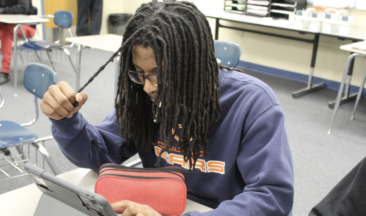 Junior Asher Harris works on homework during his free time in Mr. Mitchell's advisory on Feb. 2.