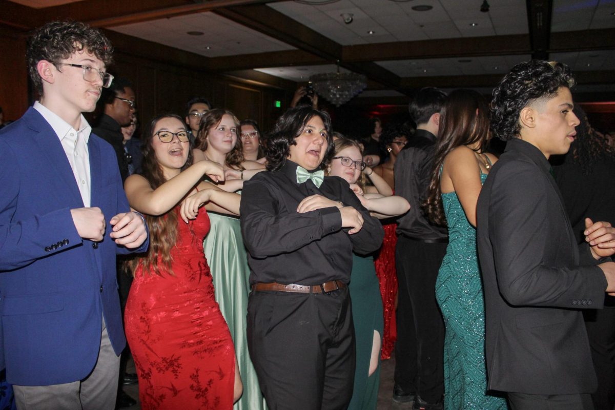 A group of GHS students dance and sing to a contemporary line dance at Turnabout on Jan. 30.  Students danced all night to a variety of different music genres.