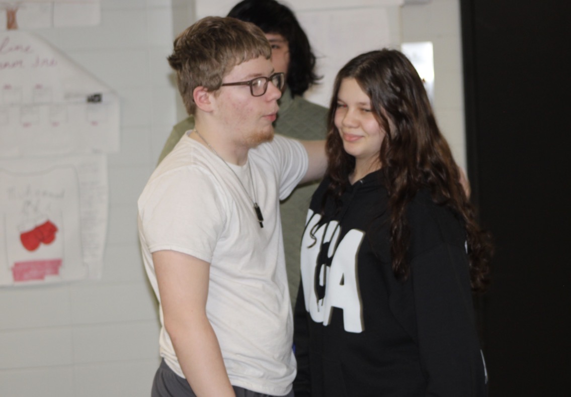 Freshman couple Zachary Sellers and Chloe Snyder share a heartfelt hug during a passing period in lower H hall on Feb.16. Sellers has just arrived at school and greets Snyder.