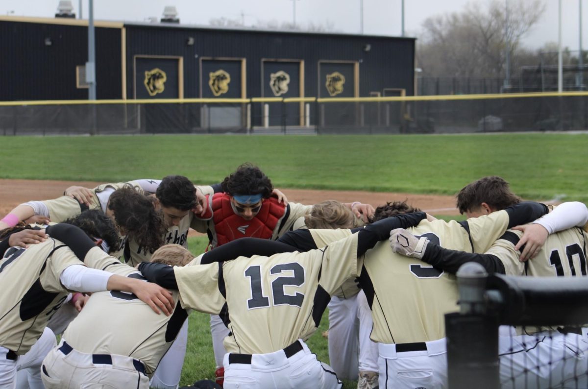 The Griffith baseball team gets a prayer in before they start a game at Brian Jennings field. Griffith prepared for their fifth game against LaPorte.