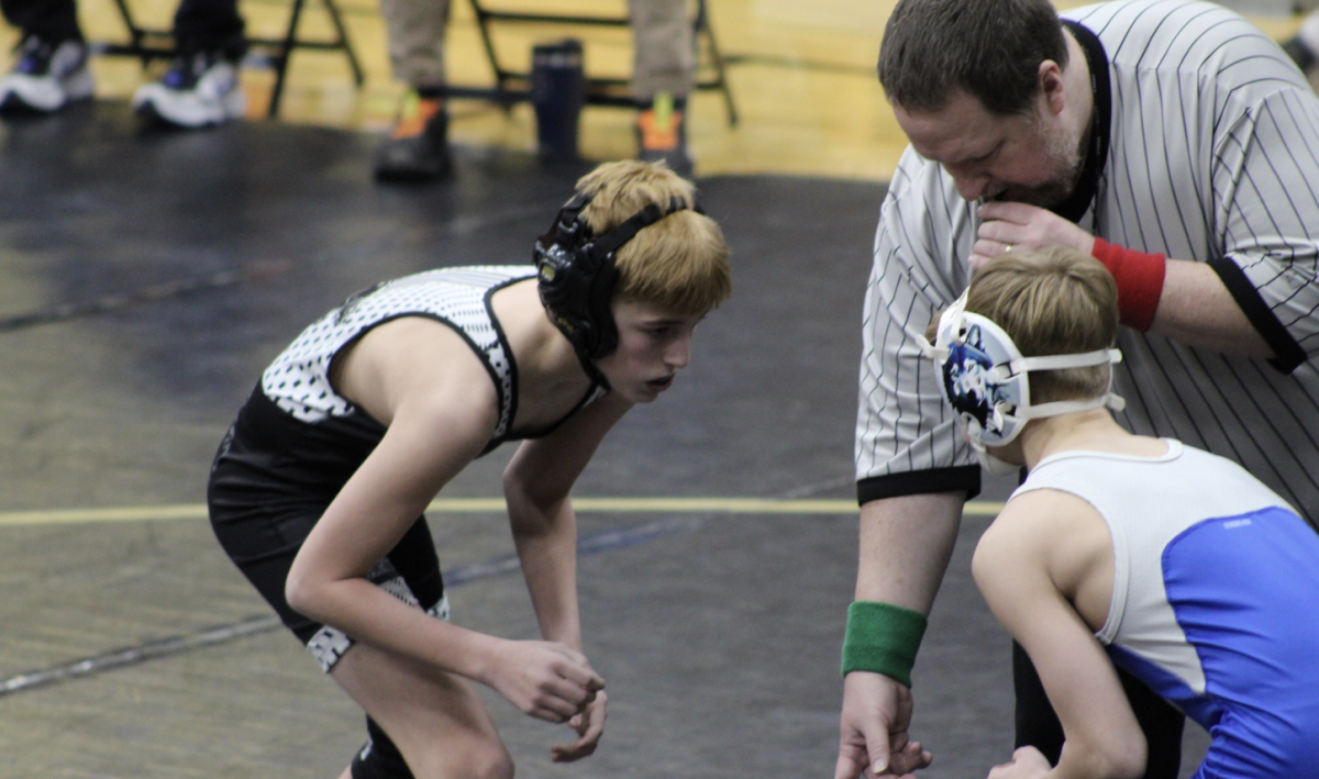 7th grader William Ethel prepares in stance before the referee blows the whistle. Ethel unfortunately did not win this match against his opponent from Highland.