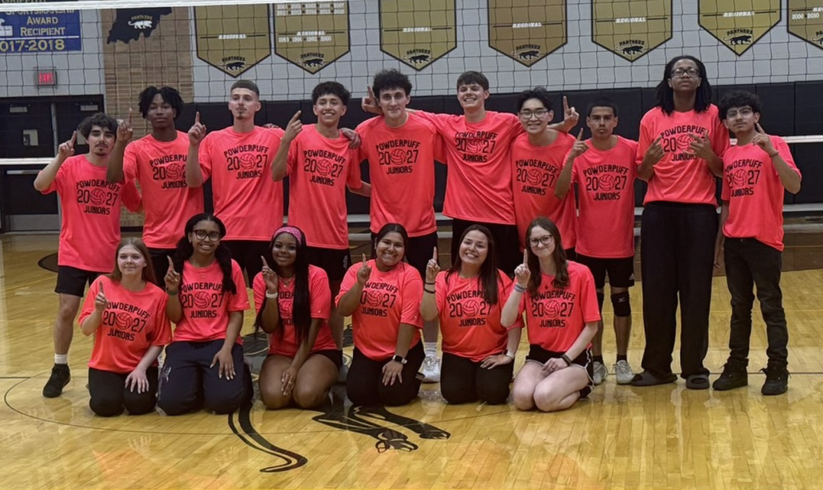 The junior roster for Powderpuff Volleyball poses after a win over the seniors on April 23. The juniors won two sets to one set.