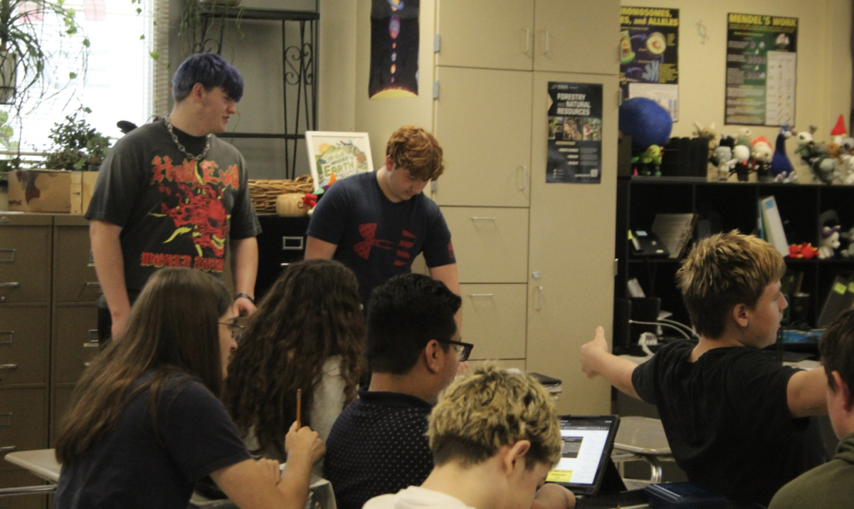 Mrs. Cooper's 4th period biology class prepare to start on their daily bellringer. Students were in the middle of the ecology unit in preperation for the field trip.