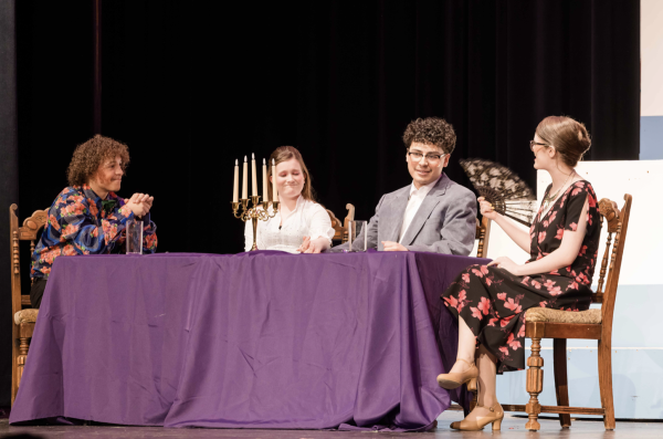 Nicholas Grahovac (Sr) sits at a table with Mya Munsie (Jr), Jeremiah Fuentes (Sr), and Kennedy Reitz (Jr). In this scene, Fuentes, who plays Frank Abagnale Jr. is having dinner with Brenda Strong (Munsie) and her parents (Grahovac and Reitz).