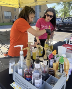 Stephanie Silva and her daughter Aliyana Silva, GHS freshman, preparing their pickled lemonade during the first Friday fest of the year. The business is also ran by Aliyana’s father and brother.